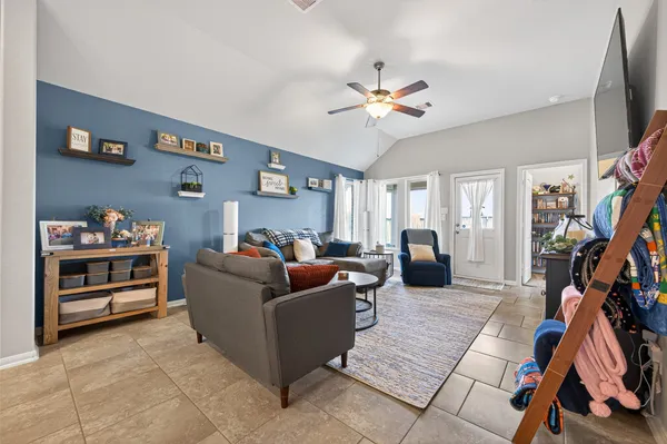 a living room with furniture and a flat screen tv