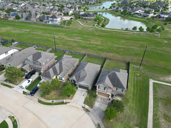an aerial view of a house with outdoor space