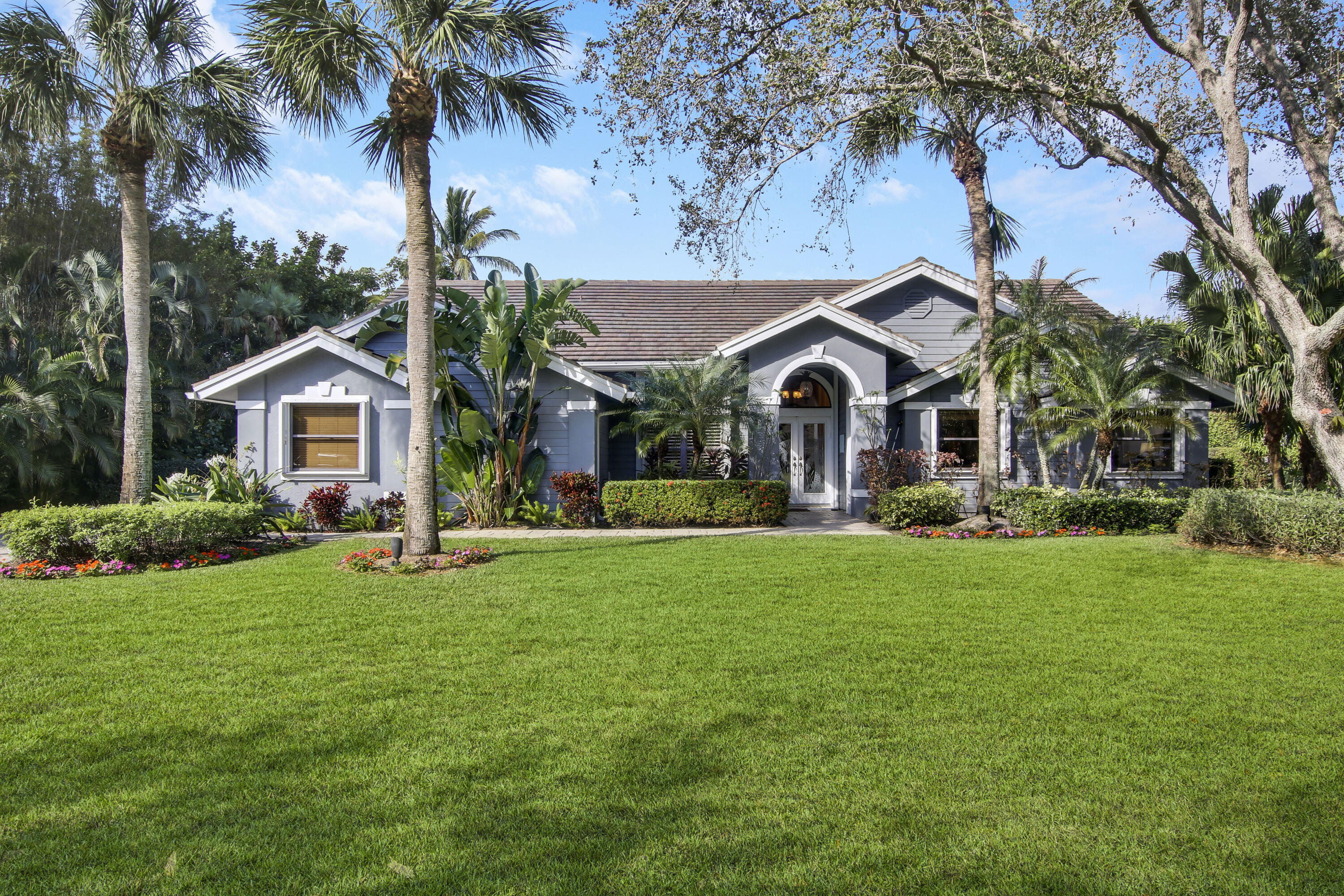 18290 Southeast Ridgeview Drive Jupiter, FL 33469 - Photo 3 of 61 Front Exterior