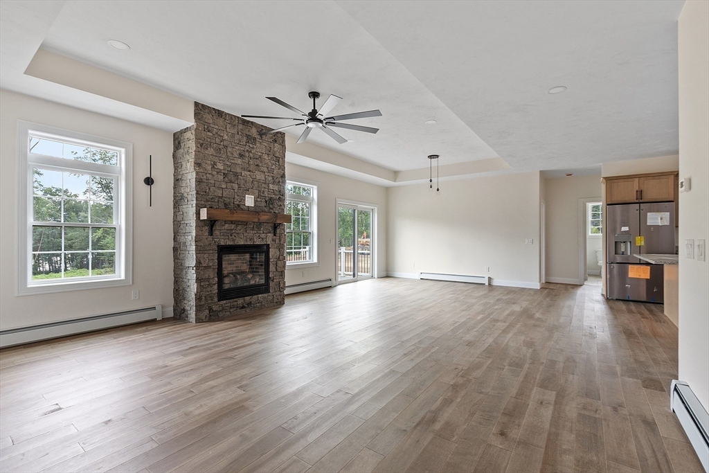 315 South Athol Road Phillipston, MA 01331 - Photo 12 of 42 a view of empty room with wooden floor and fireplace
