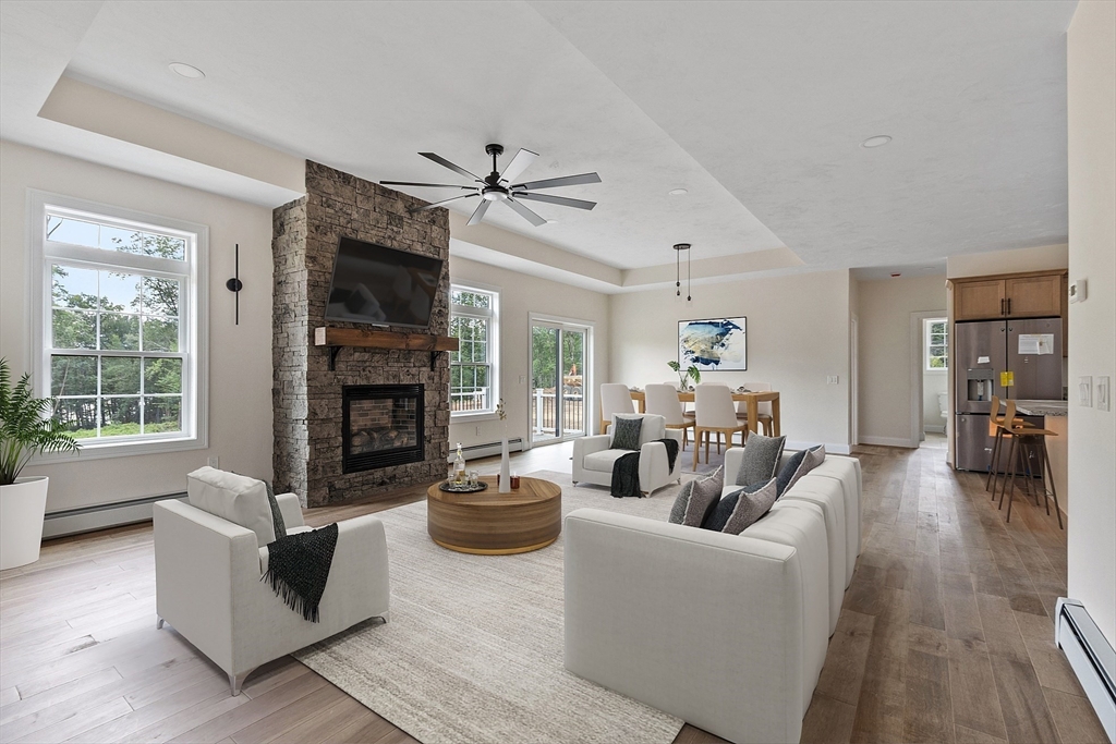 315 South Athol Road Phillipston, MA 01331 - Photo 13 of 42 a living room with furniture a fireplace and a flat screen tv