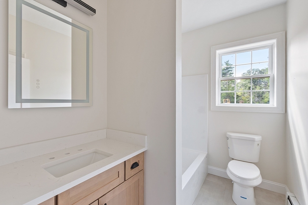 315 South Athol Road Phillipston, MA 01331 - Photo 23 of 42 a bathroom with a toilet a sink a vanity and a window
