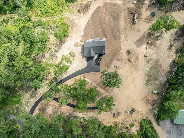 an aerial view of residential house with outdoor space