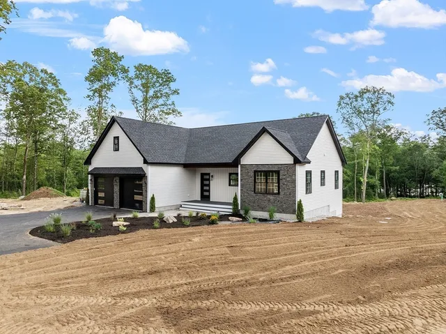 a front view of house with yard outdoor seating and barbeque oven