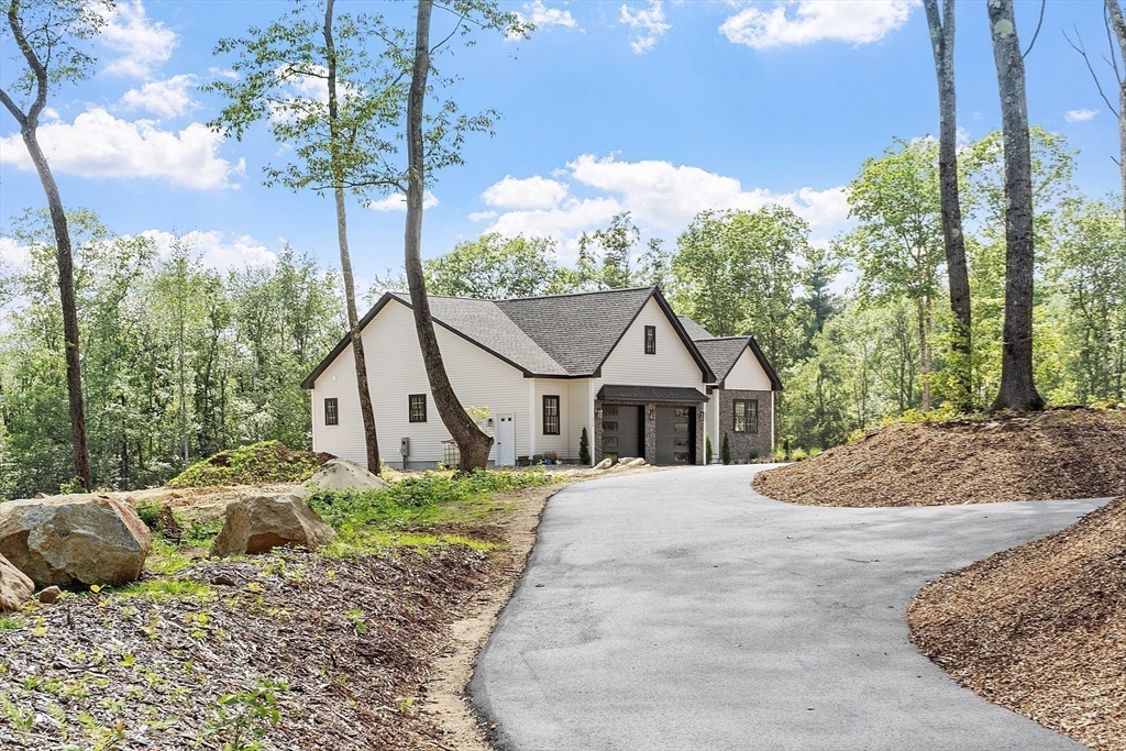 315 South Athol Road Phillipston, MA 01331 - Photo 41 of 42 a dirt road with a house in the background