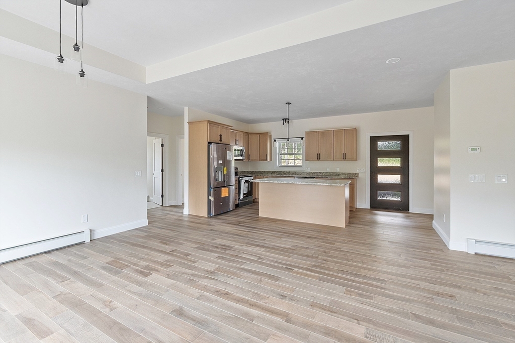 315 South Athol Road Phillipston, MA 01331 - Photo 10 of 42 a view of a kitchen with wooden floor and a window