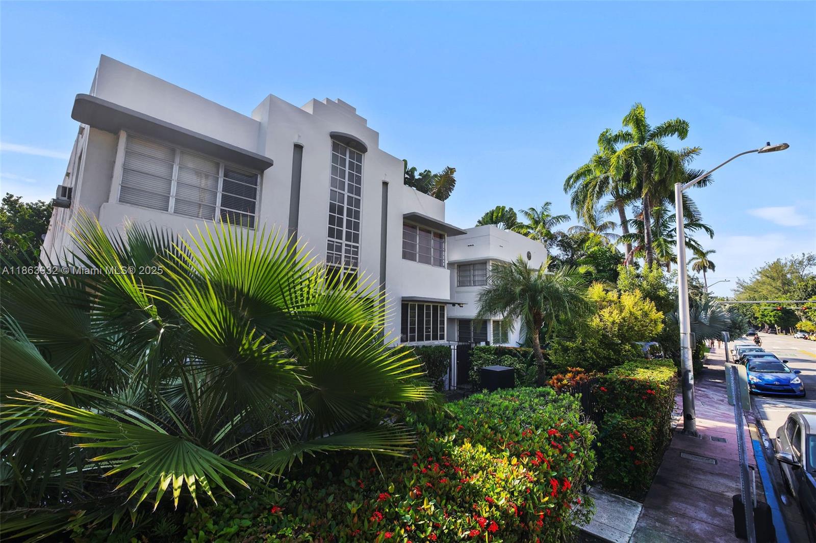 1525 Meridian Avenue, Unit 202 Miami Beach, FL 33139 - Photo 1 of 23 a front view of a house with a yard