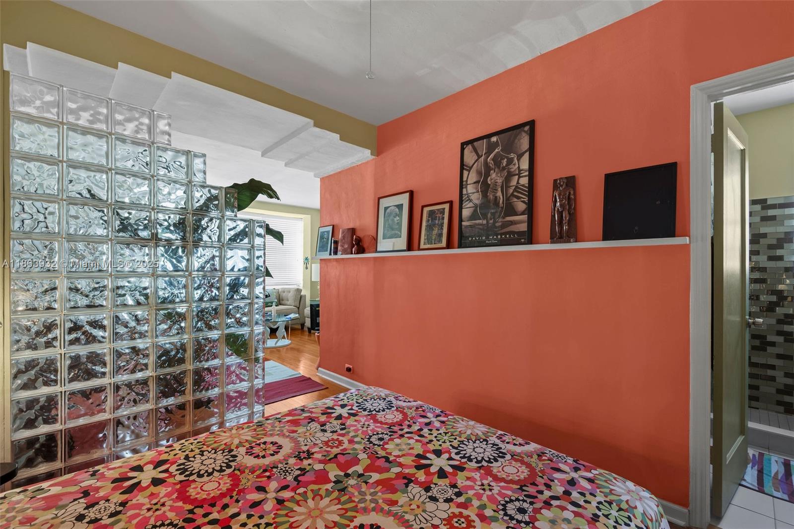 1525 Meridian Avenue, Unit 202 Miami Beach, FL 33139 - Photo 15 of 23 a bed room with a bed and a wall painting