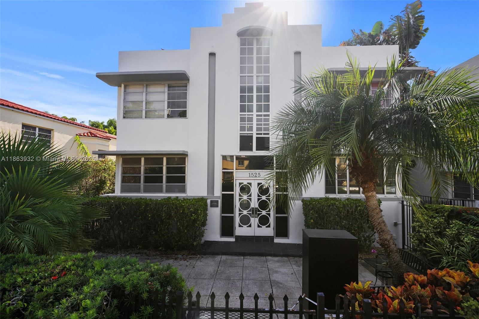 1525 Meridian Avenue, Unit 202 Miami Beach, FL 33139 - Photo 18 of 23 a front view of a house with a yard