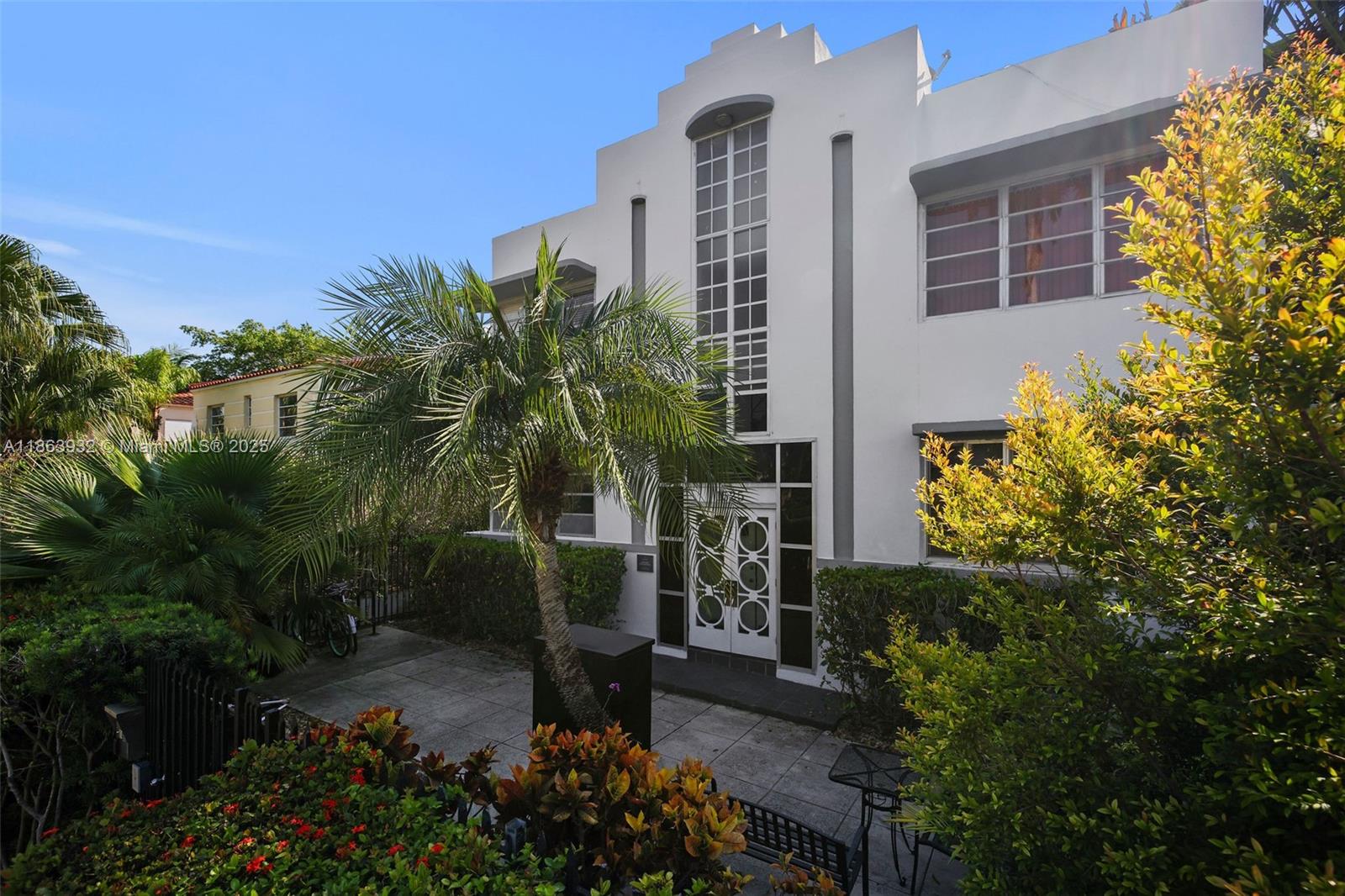 1525 Meridian Avenue, Unit 202 Miami Beach, FL 33139 - Photo 19 of 23 a backyard of a house with outdoor seating and plants