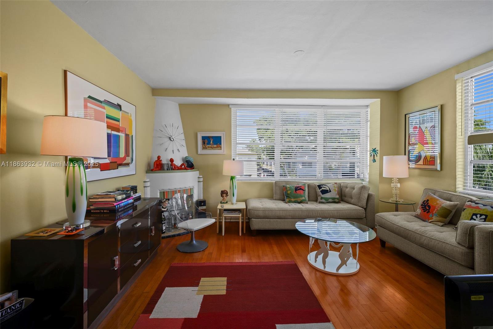 1525 Meridian Avenue, Unit 202 Miami Beach, FL 33139 - Photo 2 of 23 a living room with furniture and a flat screen tv