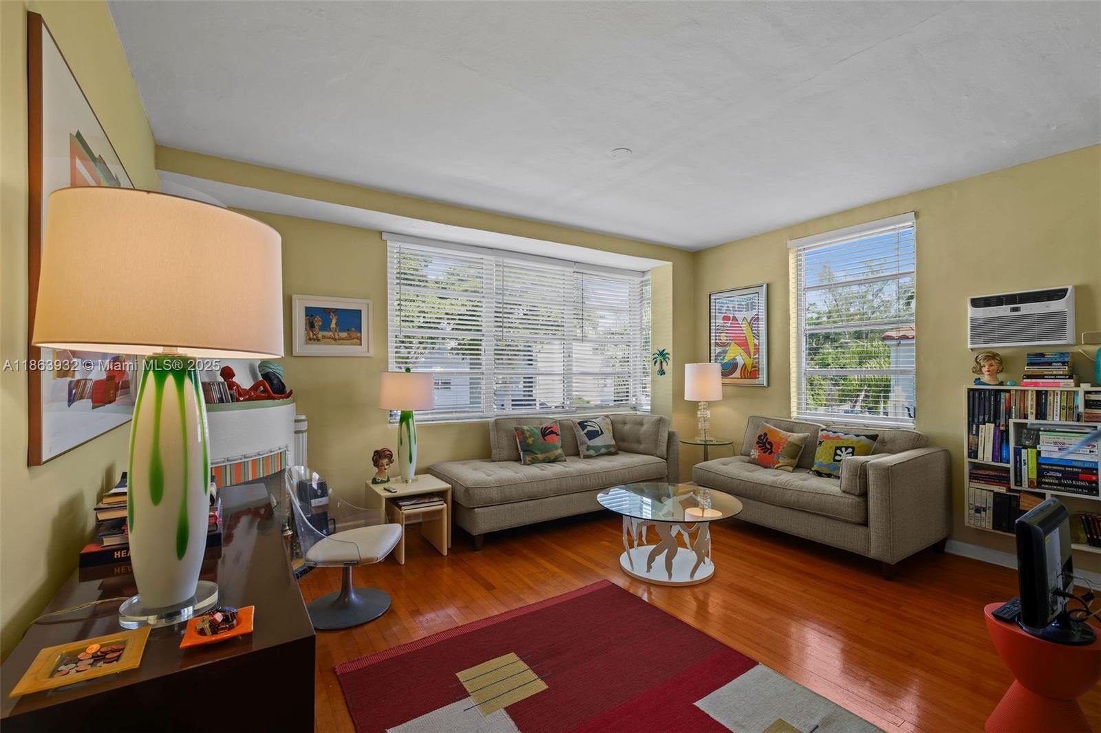 1525 Meridian Avenue, Unit 202 Miami Beach, FL 33139 - Photo 4 of 23 a living room with furniture and a flat screen tv
