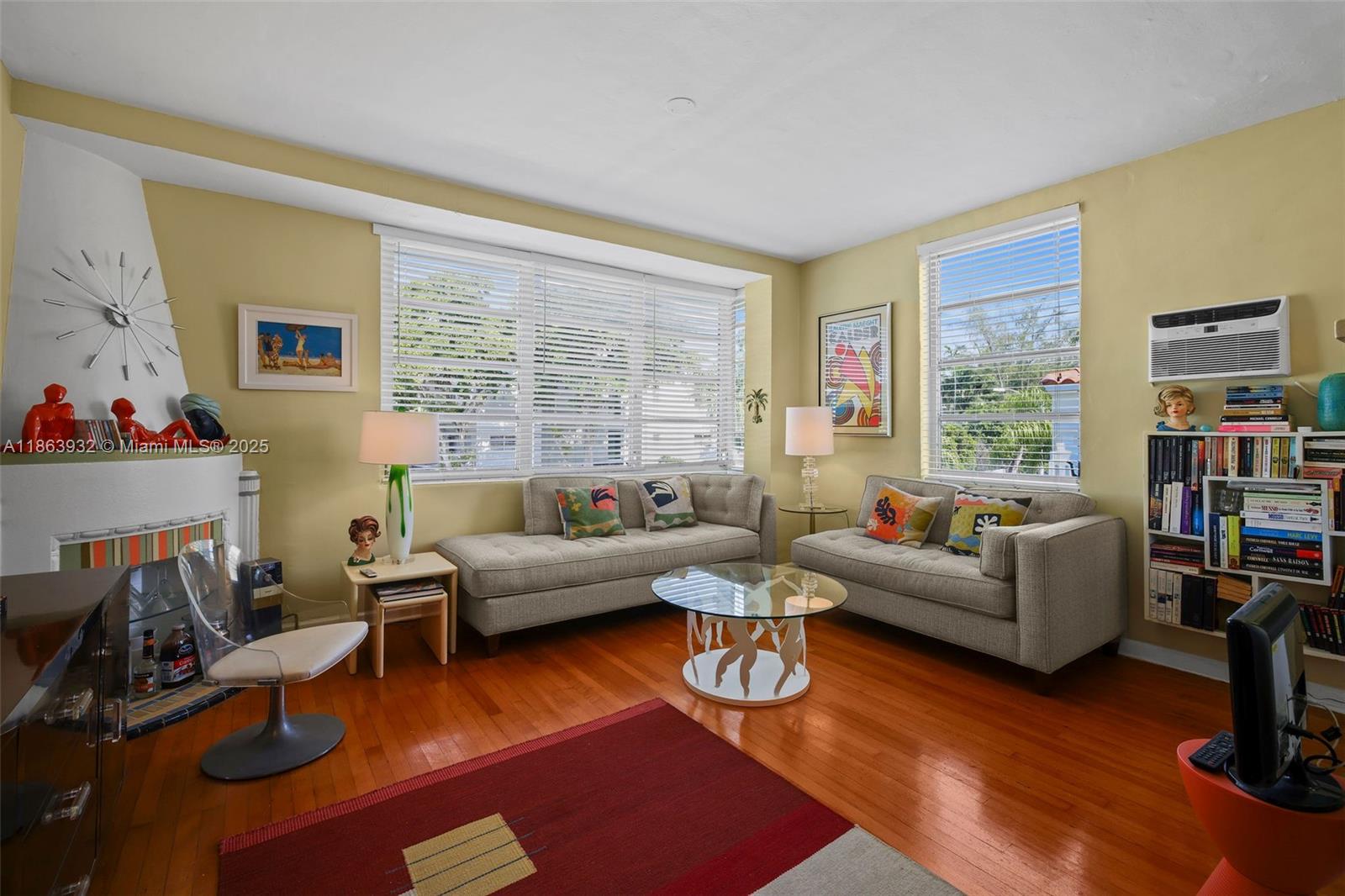 1525 Meridian Avenue, Unit 202 Miami Beach, FL 33139 - Photo 5 of 23 a living room with furniture wooden floor and a large window