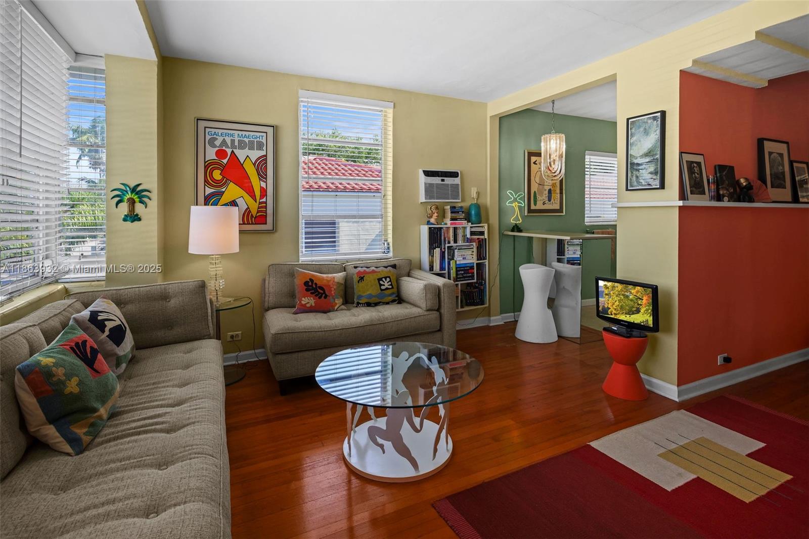 1525 Meridian Avenue, Unit 202 Miami Beach, FL 33139 - Photo 6 of 23 a living room with furniture and wooden floor