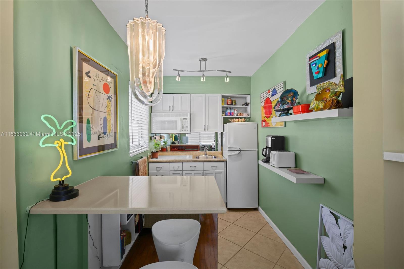 1525 Meridian Avenue, Unit 202 Miami Beach, FL 33139 - Photo 9 of 23 a living room with furniture and a table