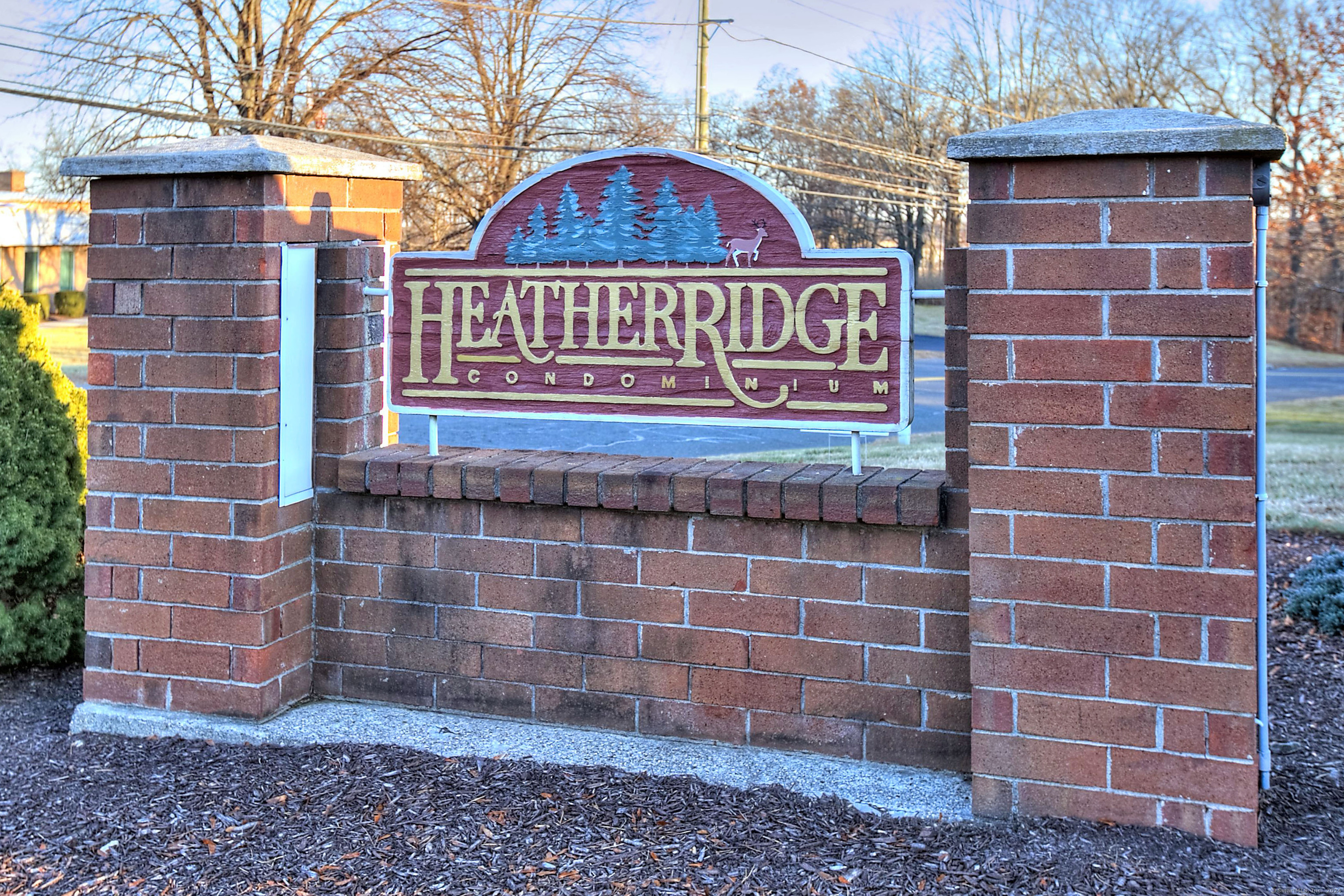 7 Heather Ridge, Unit 7 Shelton, CT 06484 - Photo 1 of 1 a sign on the side of a brick building