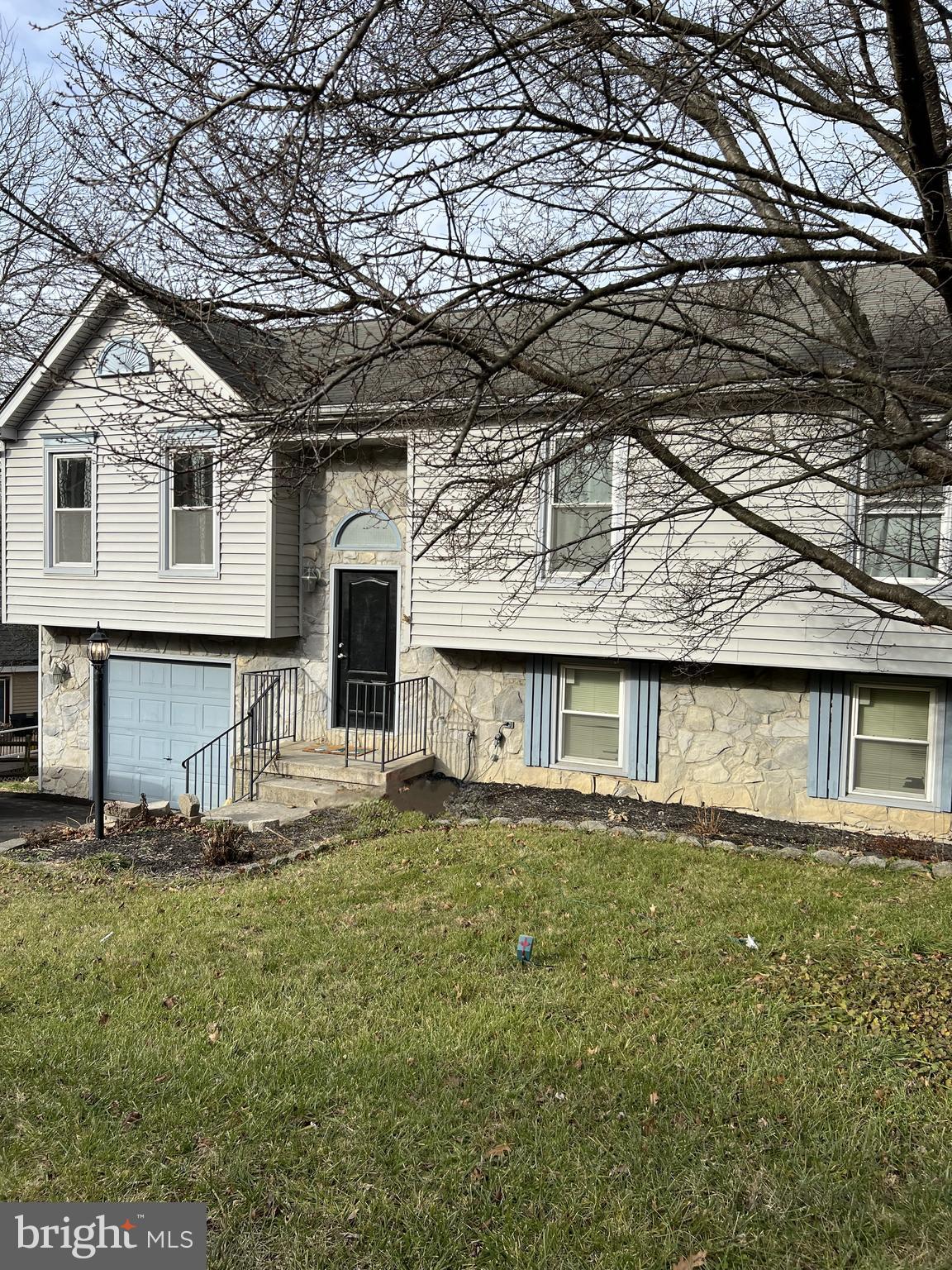 a front view of a house with yard