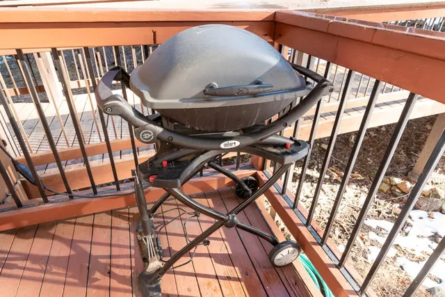 a view of a two chairs in the balcony