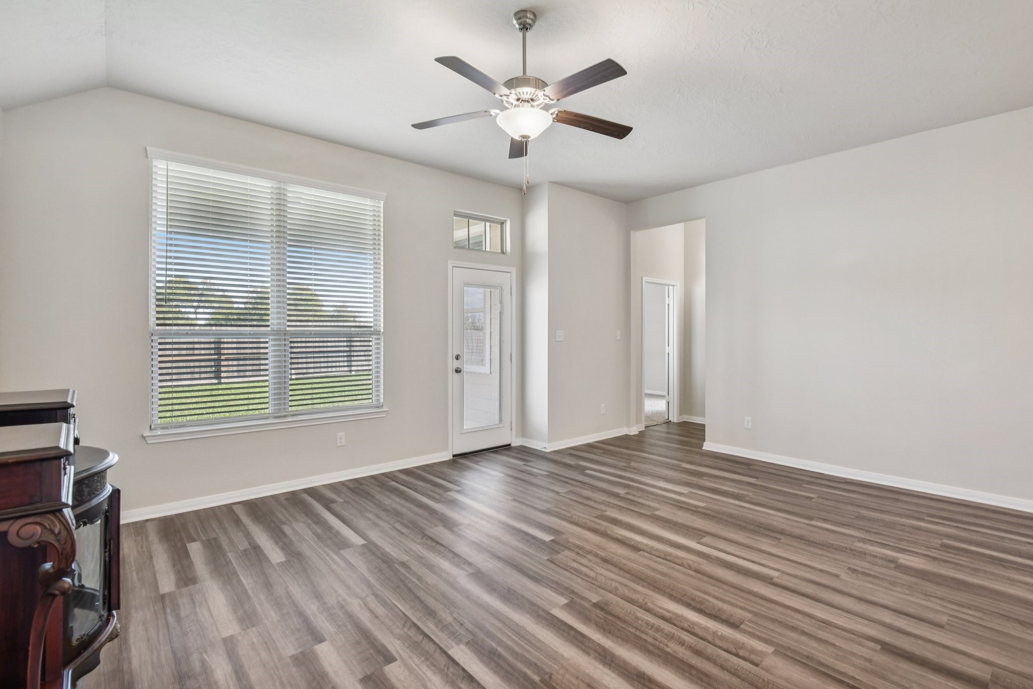 199 Racetrack Lane Montgomery, TX 77356 - Photo 13 of 40 wooden floor in an empty room with a window