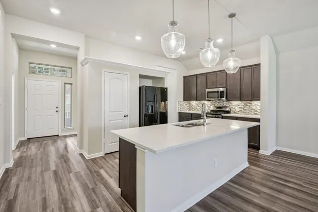 a view of kitchen and sink