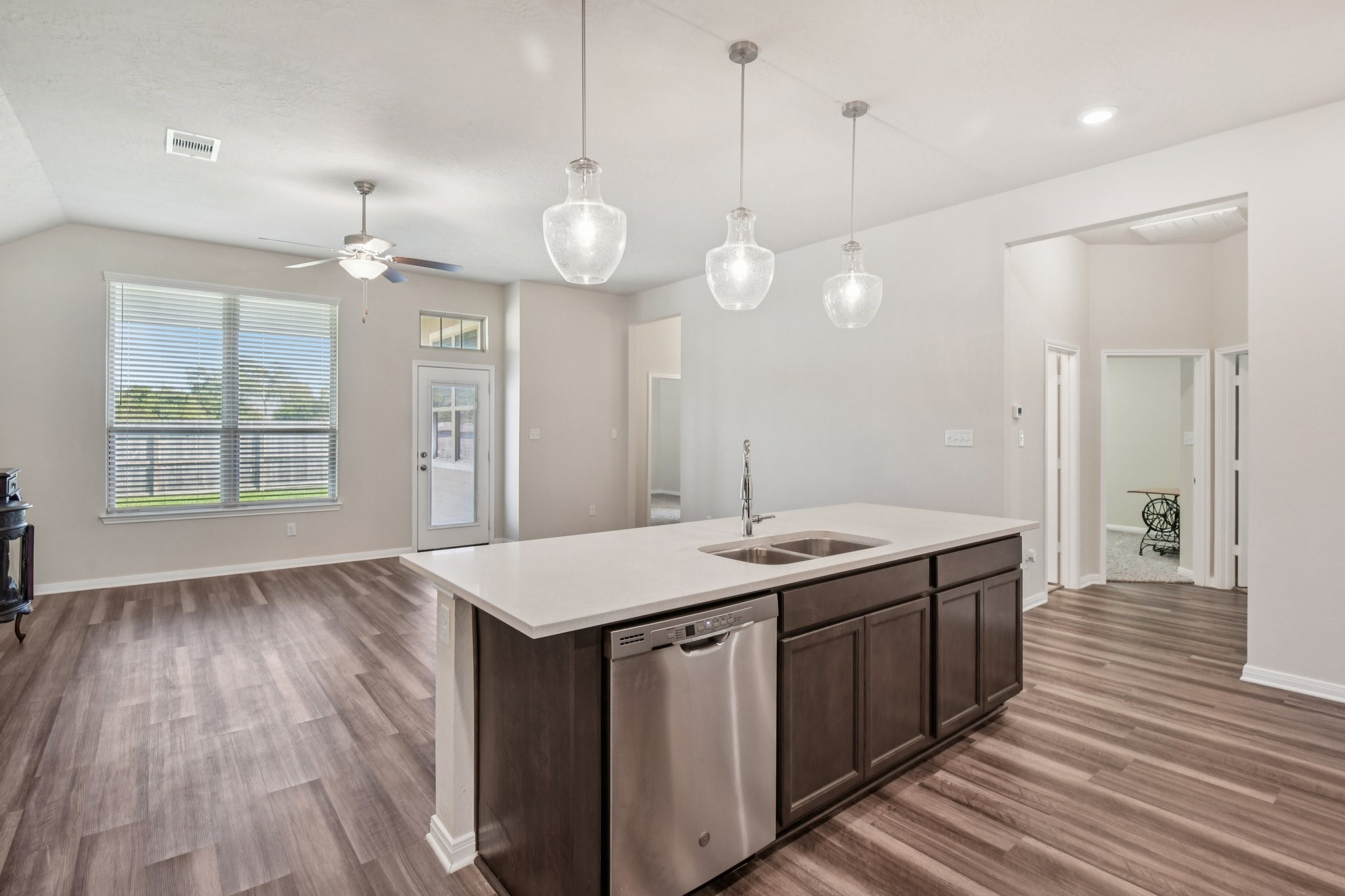 199 Racetrack Lane Montgomery, TX 77356 - Photo 17 of 40 a kitchen with a sink and wooden floor