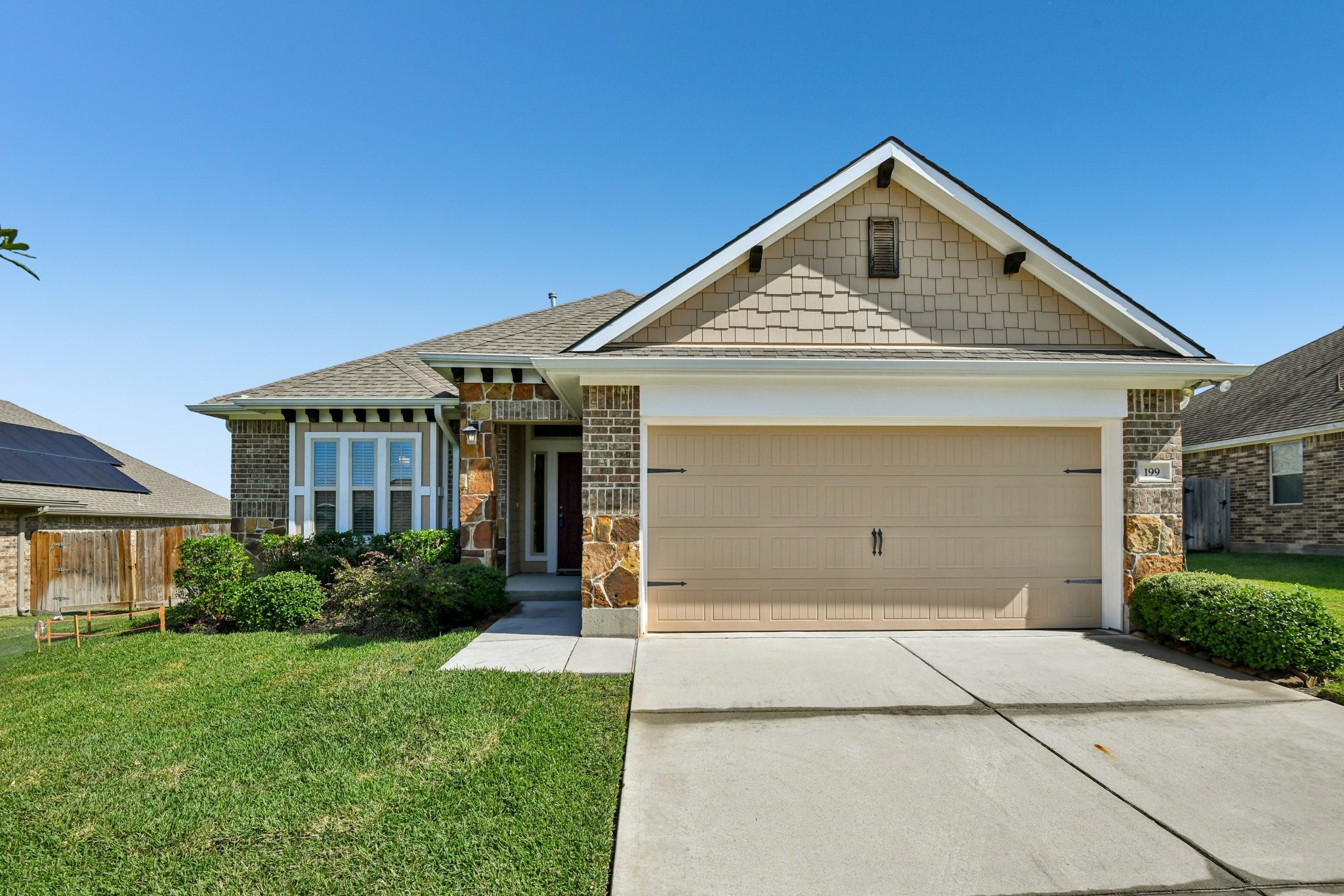 199 Racetrack Lane Montgomery, TX 77356 - Photo 2 of 40 a front view of a house with garden
