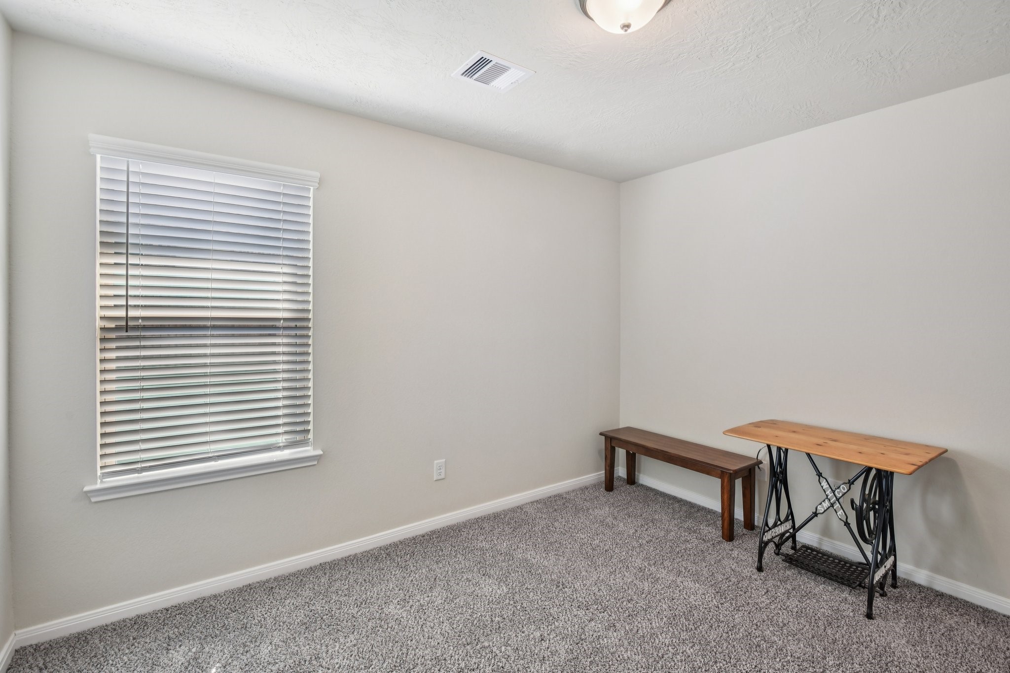 199 Racetrack Lane Montgomery, TX 77356 - Photo 21 of 40 a room with a table and a window