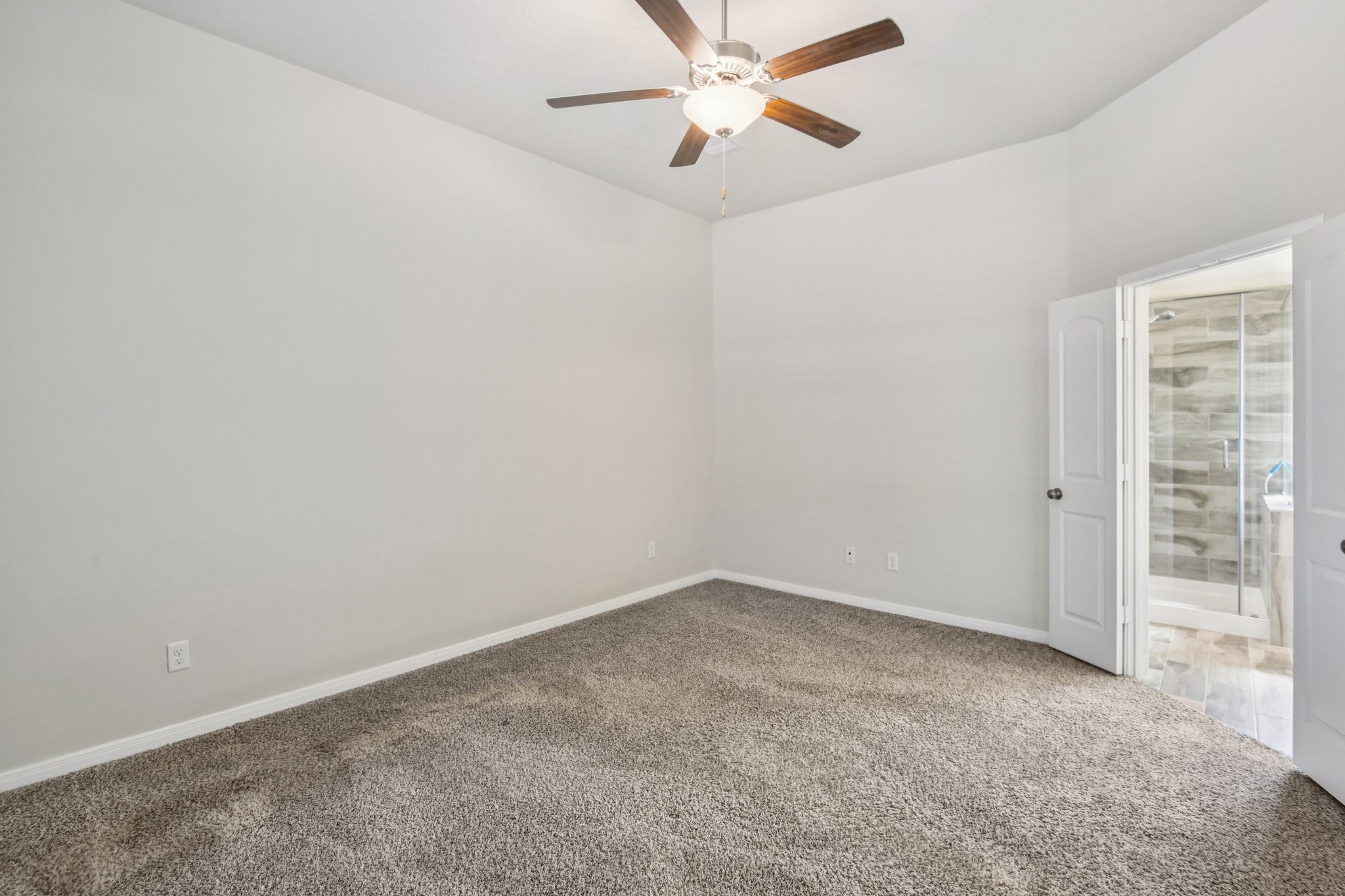 199 Racetrack Lane Montgomery, TX 77356 - Photo 26 of 40 an empty room with windows and fan