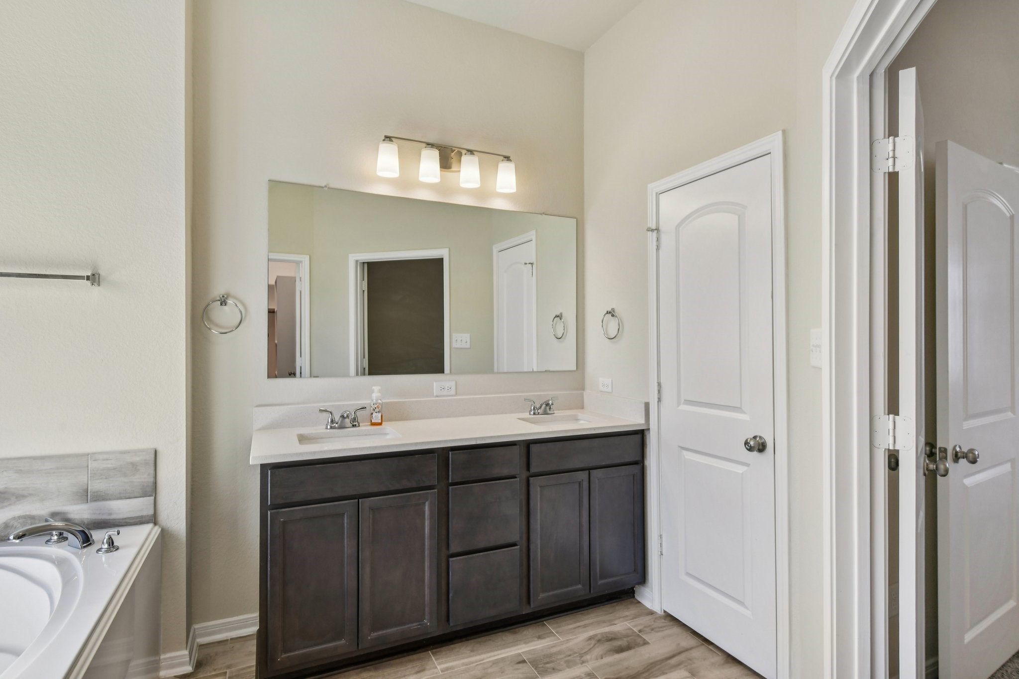 199 Racetrack Lane Montgomery, TX 77356 - Photo 32 of 40 a spacious bathroom with a double vanity sink mirror and