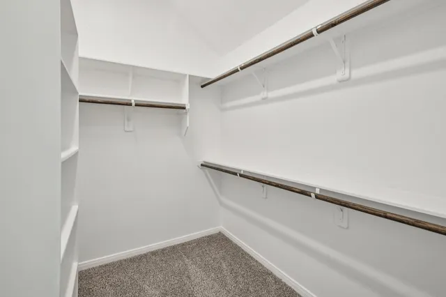 a spacious bathroom with a double vanity sink mirror and