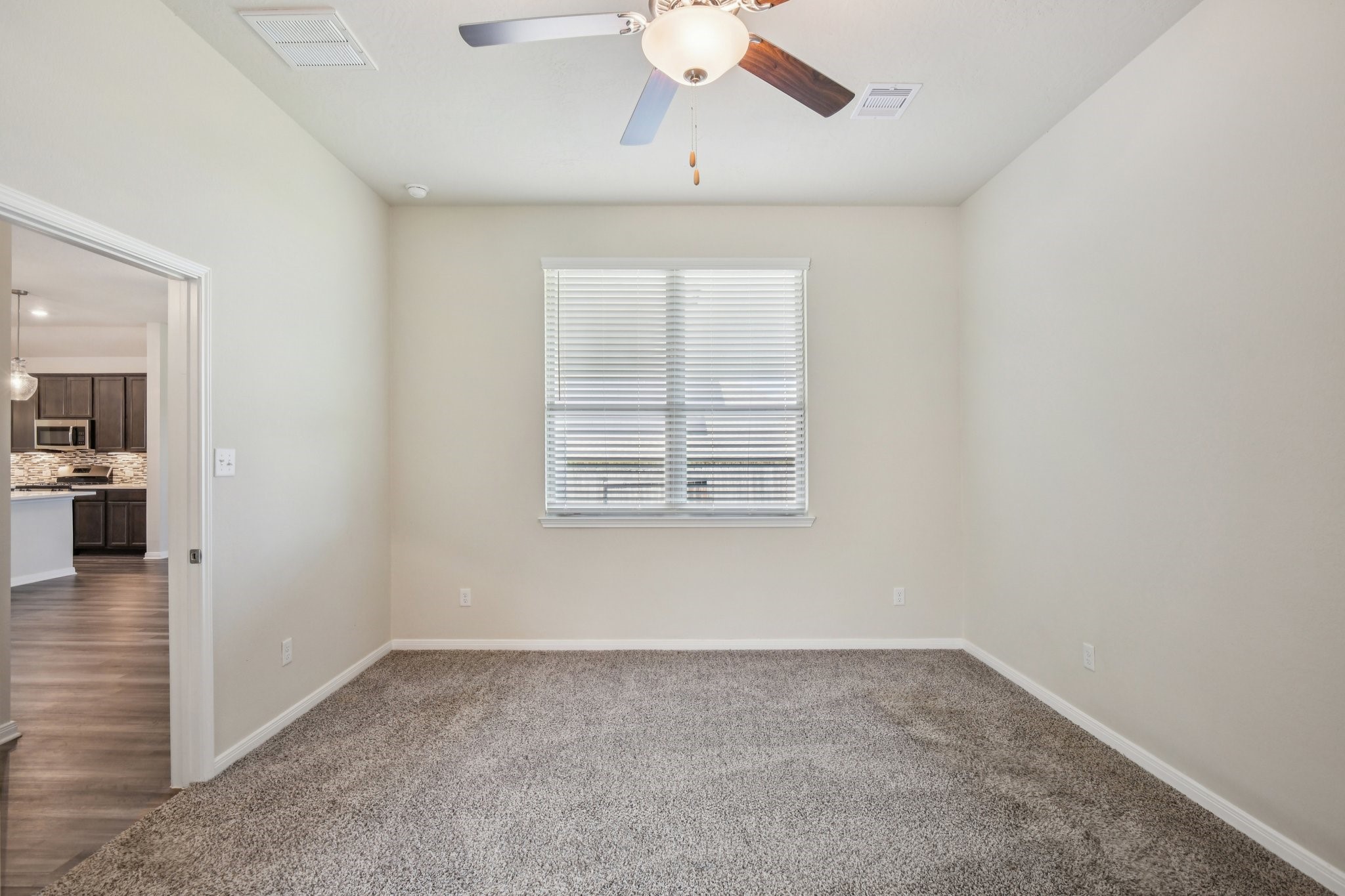 199 Racetrack Lane Montgomery, TX 77356 - Photo 34 of 40 en empty room with windows and ceiling fan