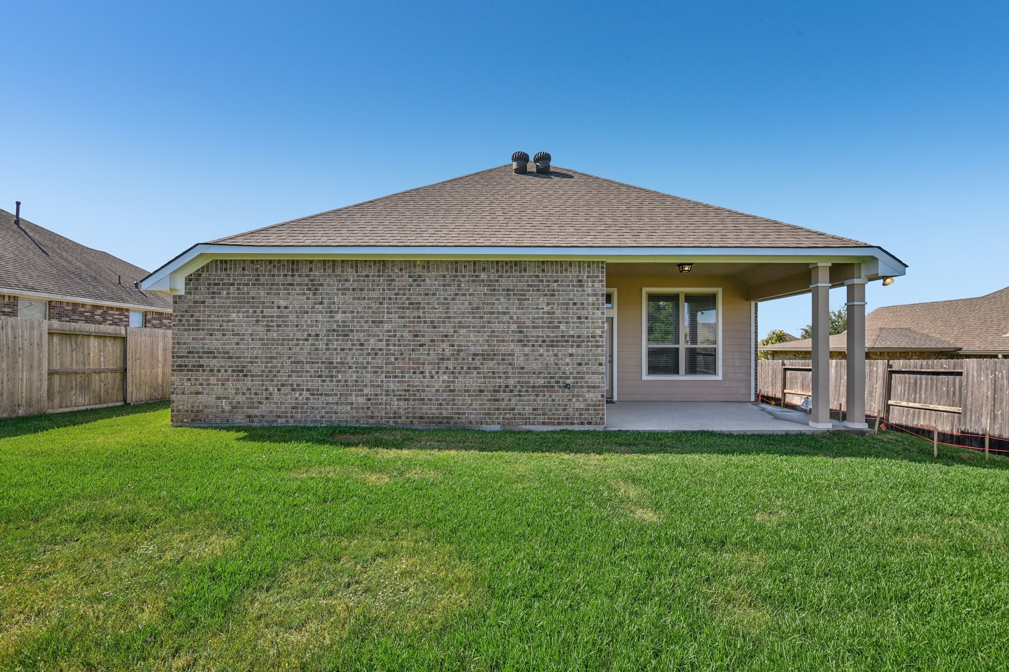 199 Racetrack Lane Montgomery, TX 77356 - Photo 36 of 40 a brick house with a yard