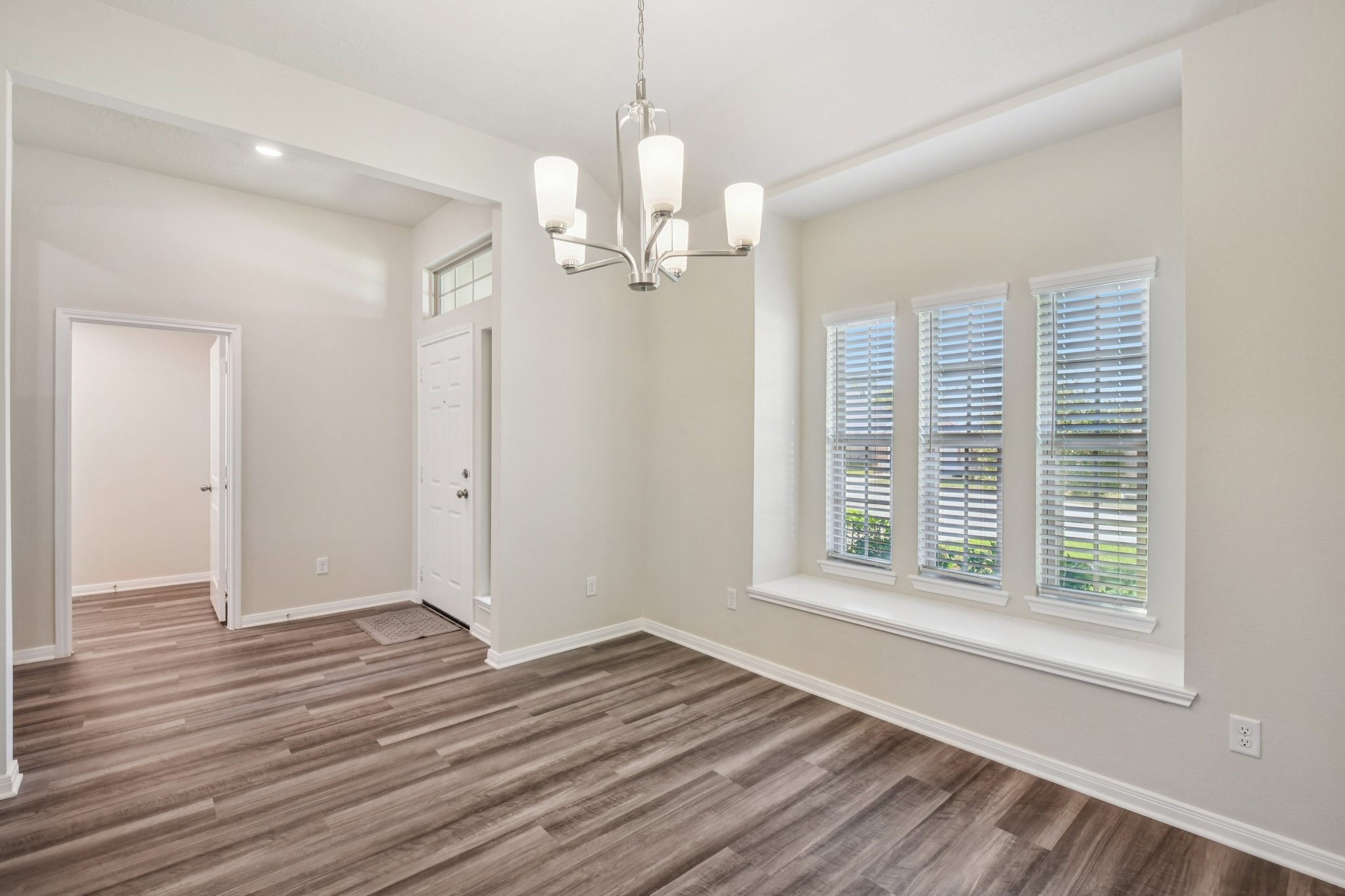 199 Racetrack Lane Montgomery, TX 77356 - Photo 7 of 40 wooden floor in an empty room with a window