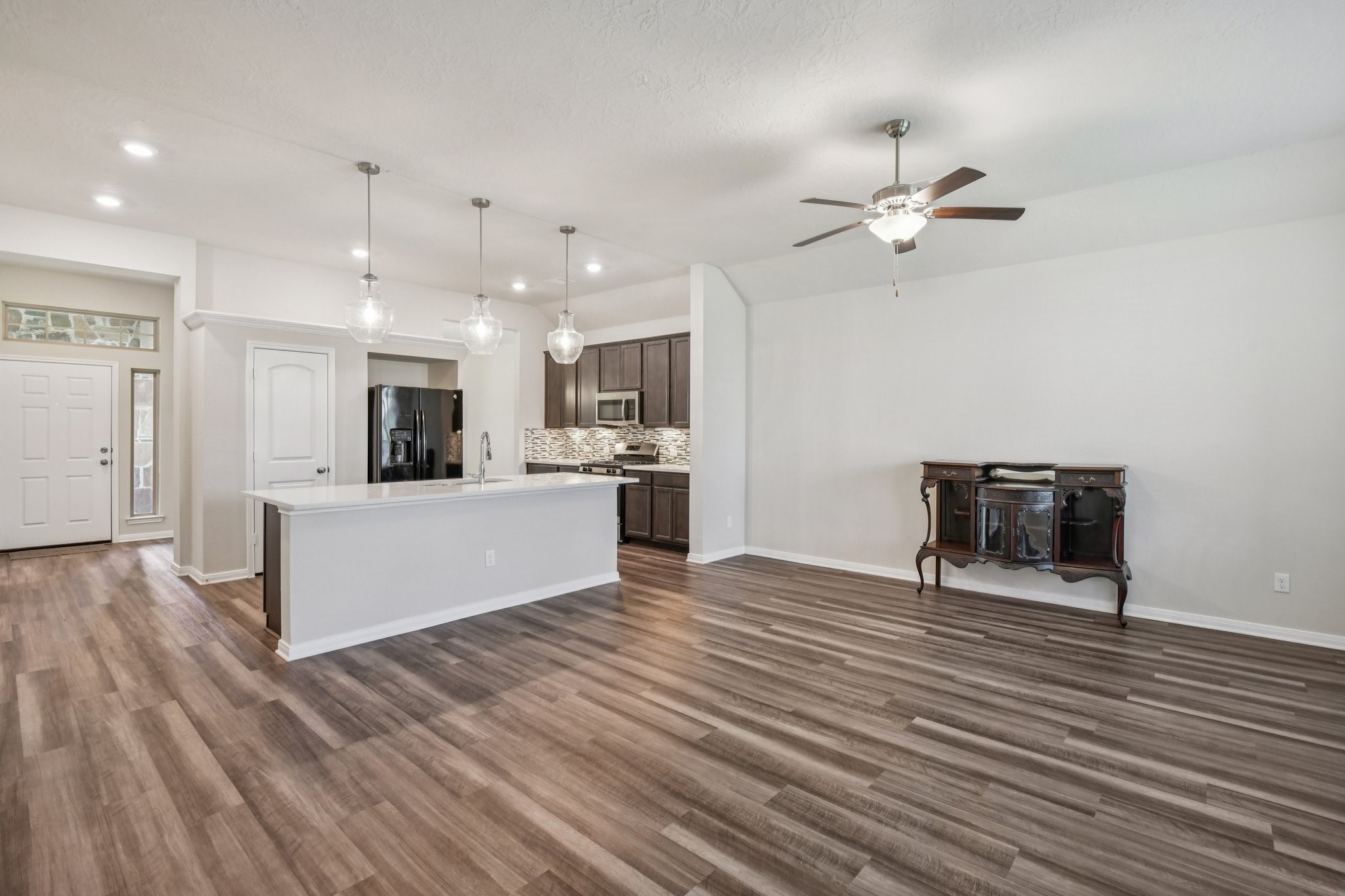 199 Racetrack Lane Montgomery, TX 77356 - Photo 10 of 40 a view of kitchen with cabinets microwave and stove