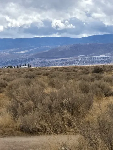 a view of an ocean and mountain