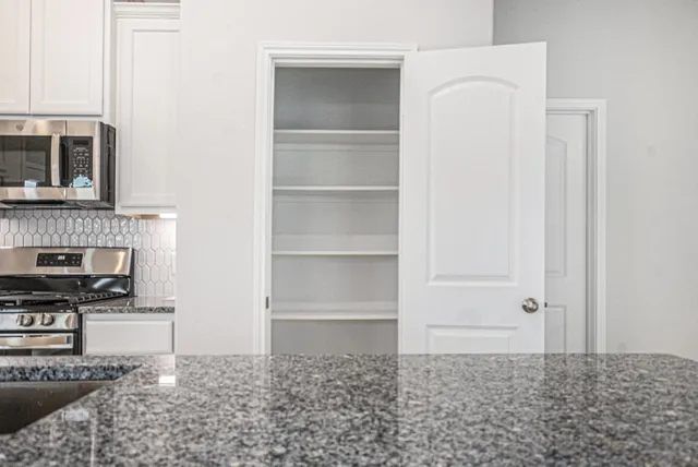 a view of a livingroom with wooden floor