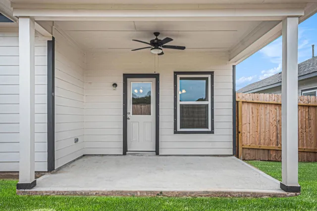 a view of an house with backyard space and garden