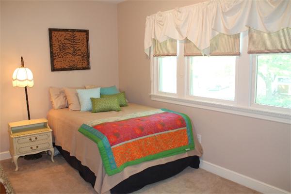 28 Columbus Street Lexington, MA 02421 - Photo 17 of 27 a bedroom with a bed and a window