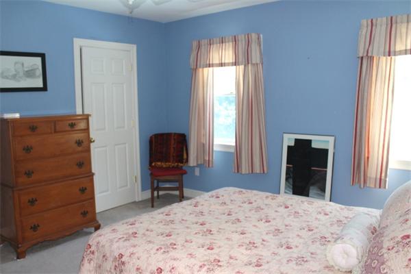 28 Columbus Street Lexington, MA 02421 - Photo 19 of 27 a bedroom with a bed and a dresser