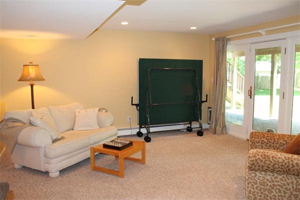 28 Columbus Street Lexington, MA 02421 - Photo 22 of 27 a living room with furniture gym equipment and a window