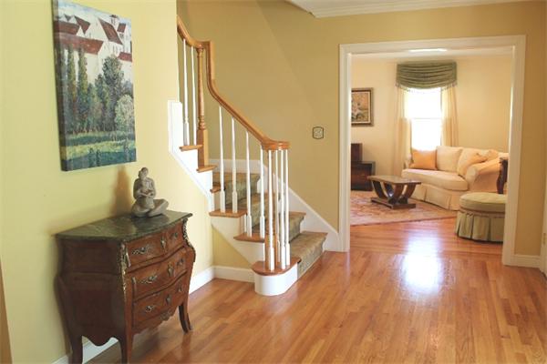 28 Columbus Street Lexington, MA 02421 - Photo 3 of 27 a living room with fireplace furniture and a wooden floor