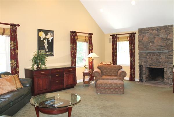 28 Columbus Street Lexington, MA 02421 - Photo 8 of 27 a living room with furniture and a fireplace