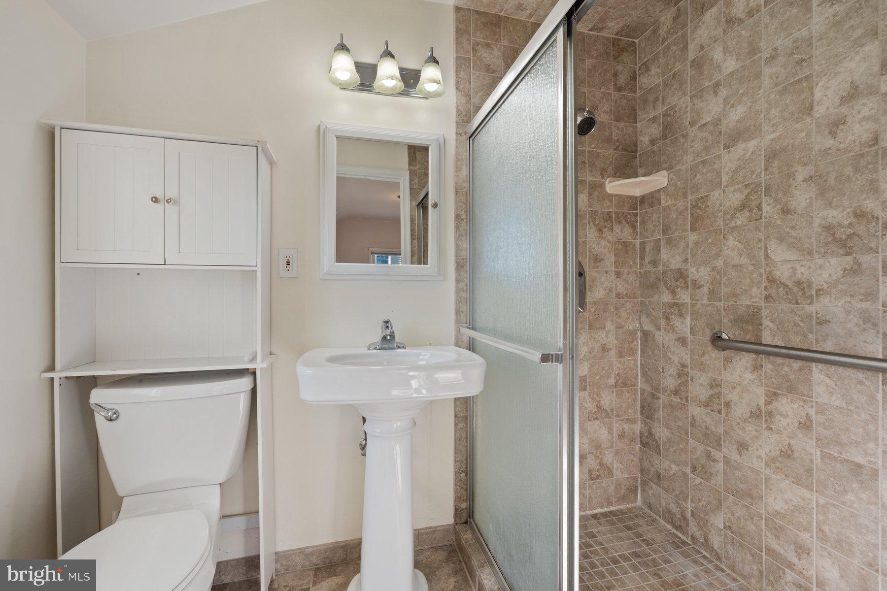 3151 Castleleigh Road Silver Spring, MD 20904 - Photo 26 of 42 Modern bathroom with elegant tile accents.