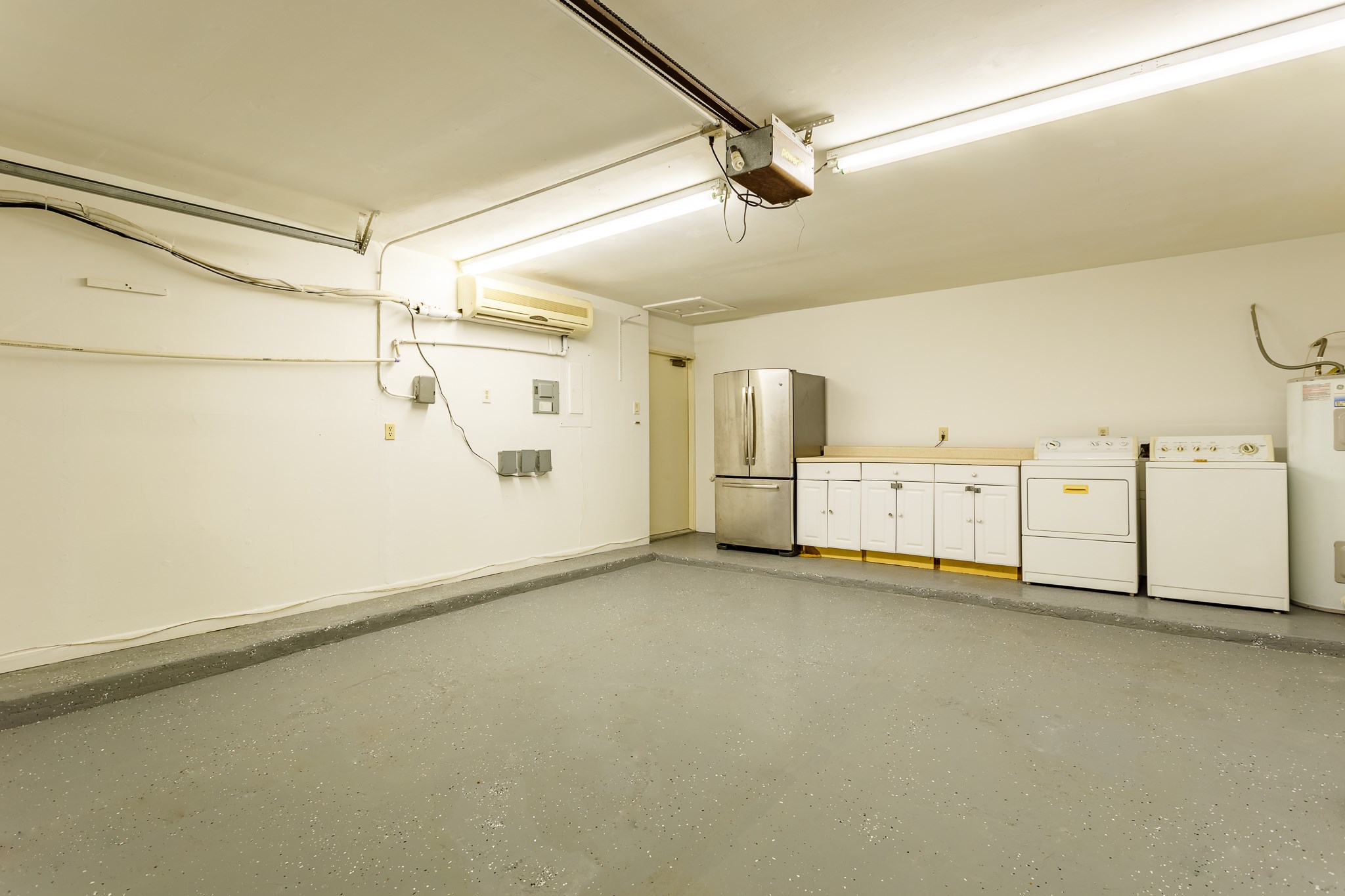 2349 Albans Road, Unit 1 Houston, TX 77005 - Photo 13 of 14 Garage features a polished concrete floor and ample lighting.