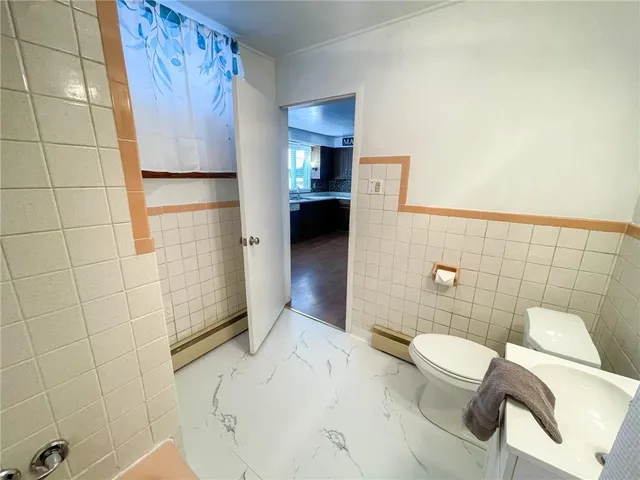 a bathroom with a sink and toilet