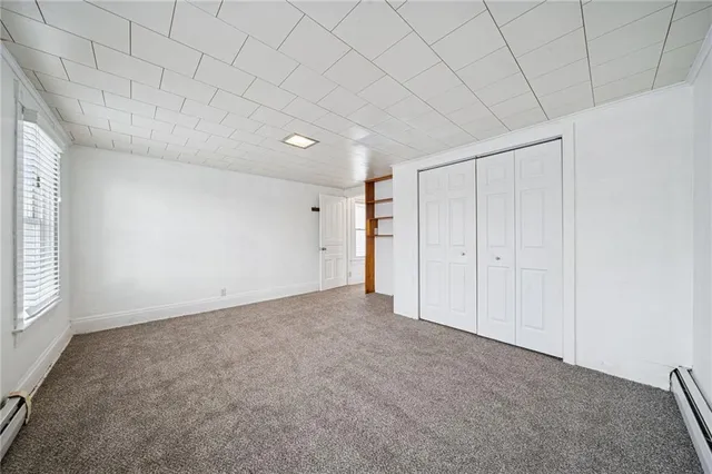 a view of an empty room and a window