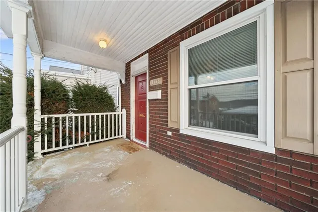 a view of a balcony with a swing