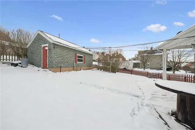 a view of a house with a snow in the yard