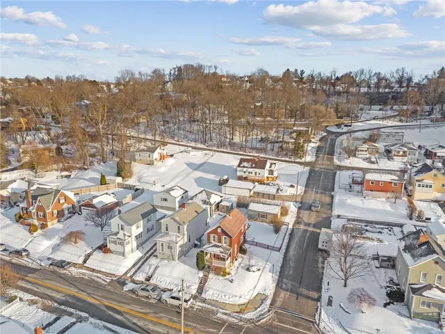 an aerial view of residential building with parking space