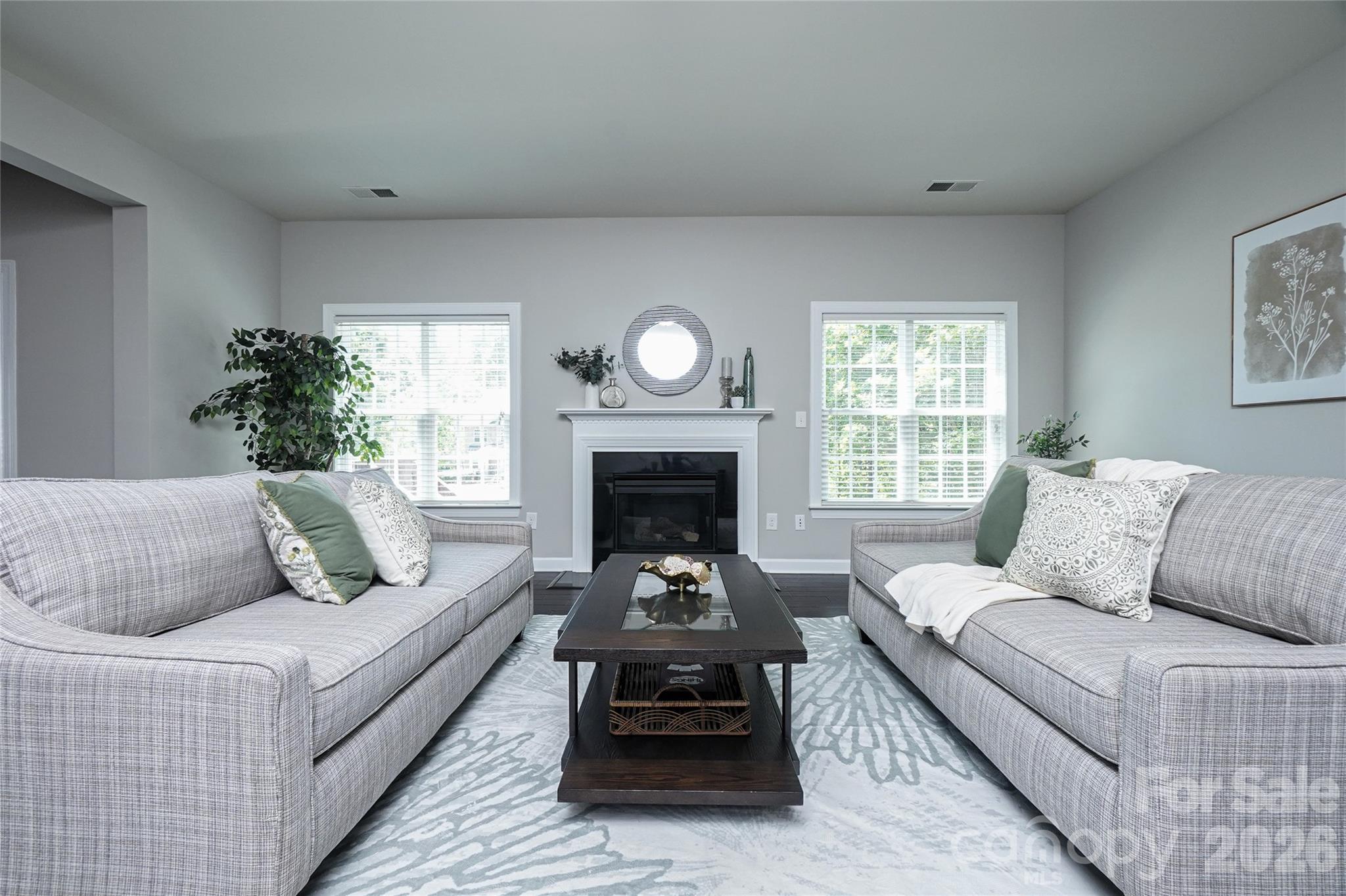 4008 Oxford Mill Road Waxhaw, NC 28173 - Photo 19 of 44 a living room with furniture and a fireplace